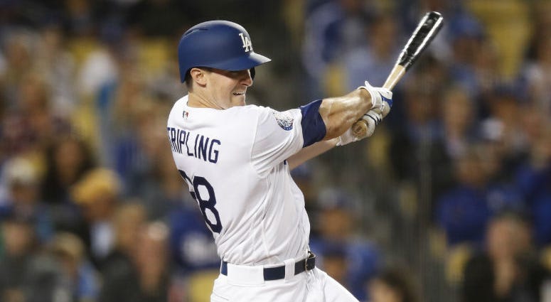 Los Angeles Dodgers starting pitcher Ross Stripling follows through on an RBI single during the fifth inning against the Philadelphia Phillies in a baseball game Wednesday, May 30, 2018, in Los Angeles. Los Angeles Dodgers starting pitcher Ross Stripling