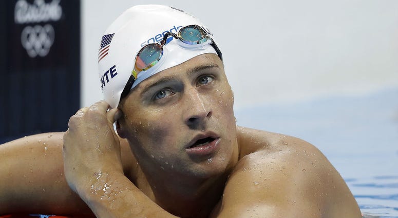 In this Tuesday, Aug. 9, 2016, file photo, United States' Ryan Lochte checks his time in a men's 4x200-meter freestyle heat at the 2016 Summer Olympics, in Rio de Janeiro, Brazil. In this Tuesday, Aug. 9, 2016, file photo, United States' Ryan Lochte checks his time in a men's 4x200-meter freestyle heat at the 2016 Summer Olympics, in Rio de Janeiro, Brazil.