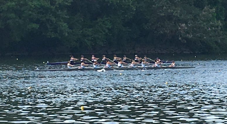 A crew team rows on the Schuylkill River. A crew team rows on the Schuylkill River.