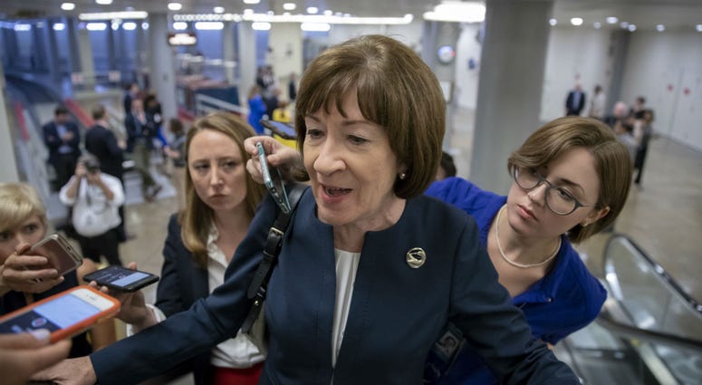 In this Aug. 21, 2018, file photoSen. Susan Collins, R-Maine, speaks with reporters on an escalator at the Capitol in Washington. In this Aug. 21, 2018, file photoSen. Susan Collins, R-Maine, speaks with reporters on an escalator at the Capitol in Washington.