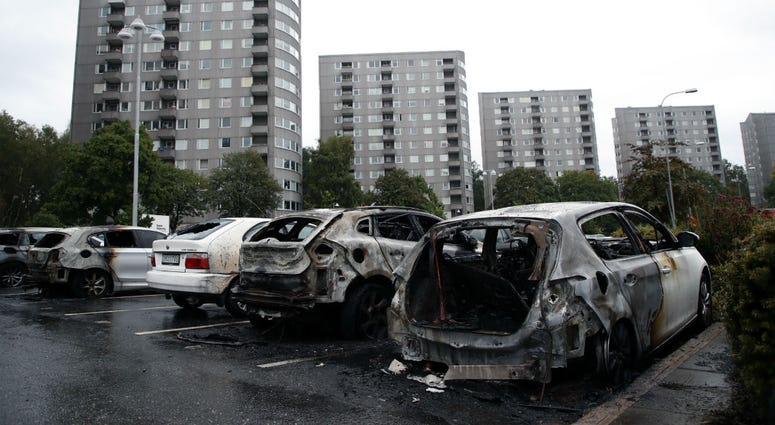 Burned cars parked at Frolunda Square in Gothenburg, Tuesday, Aug. 14, 2018. Burned cars parked at Frolunda Square in Gothenburg, Tuesday, Aug. 14, 2018.