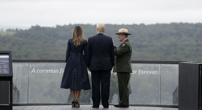 President Donald Trump and first lady Melania Trump, escorted by Stephen Clark, Superintendent of the National Parks of Western Pennsylvania, walk along the September 11th Flight 93 memorial, Tuesday, Sept. 11, 2018, in Shanksville, Pa. President Donald Trump and first lady Melania Trump, escorted by Stephen Clark, Superintendent of the National Parks of Western Pennsylvania, walk along the September 11th Flight 93 memorial, Tuesday, Sept. 11, 2018, in Shanksville, Pa.