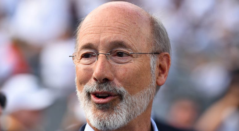 Pennsylvania Gov. Tom Wolf looks on from the field prior to the game between the Pittsburgh Panthers and the Penn State Nittany Lions at Beaver Stadium. Gov. Tom Wolf