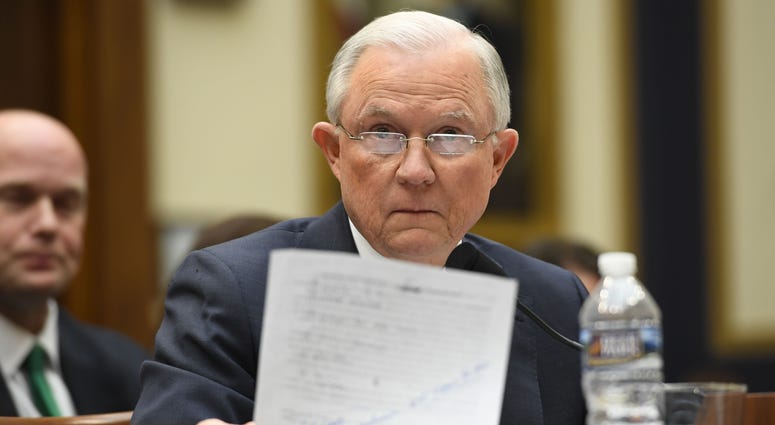 Attorney General Jeff Sessions holds a sheet of paper containing text related to questioning by Sen. Al Frankenfrom Sessions' confirmation hearing in 2017 before the House Judiciary Committee during an oversight hearing on the Department of Justice. Attorney General Jeff Sessions holds a sheet of paper containing text related to questioning by Sen. Al Frankenfrom Sessions' confirmation hearing in 2017 before the House Judiciary Committee during an oversight hearing on the Department of Justice.