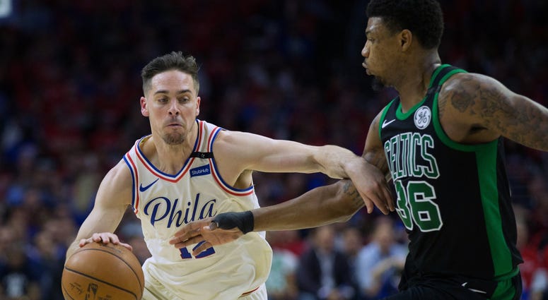 Philadelphia 76ers guard T.J. McConnell (12) dribbles against Boston Celtics guard Marcus Smart (36) during the first quarter in game four of the second round of the 2018 NBA Playoffs. Philadelphia 76ers guard T.J. McConnell (12) dribbles against Boston Celtics guard Marcus Smart (36) during the first quarter in game four of the second round of the 2018 NBA Playoffs.