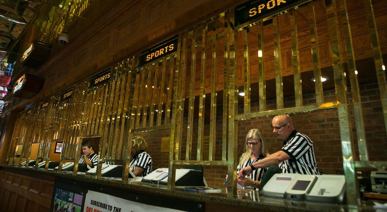 Workers prepare their stations as Delaware launches the country's first full-scale sports betting operation outside of Nevada. Sports Betting