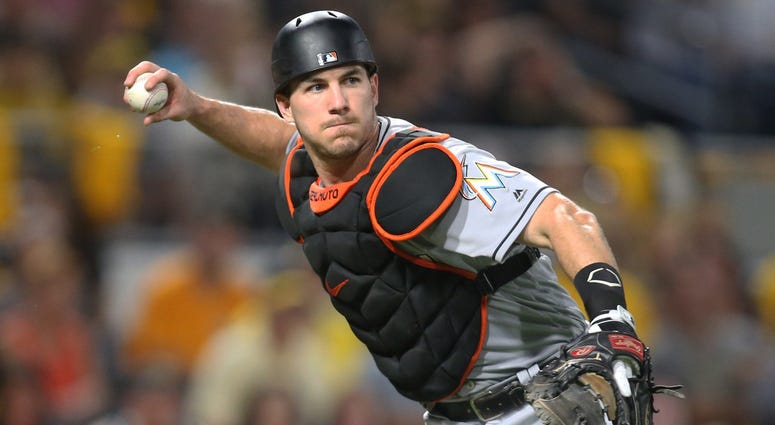 Miami Marlins catcher J.T. Realmuto (11) throws to first base to retire Pittsburgh Pirates starting pitcher Chris Archer (not pictured) during the third inning at PNC Park, Sept. 7, 2018. J.T. Realmuto