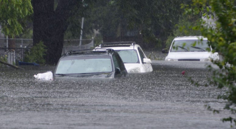 Hurricane Florence brought enough rain to cover the cars parked on 6th St in Washington, N.C. to be covered over the hood with water on Friday afternoon on September 14, 2018. Hurricane Florence