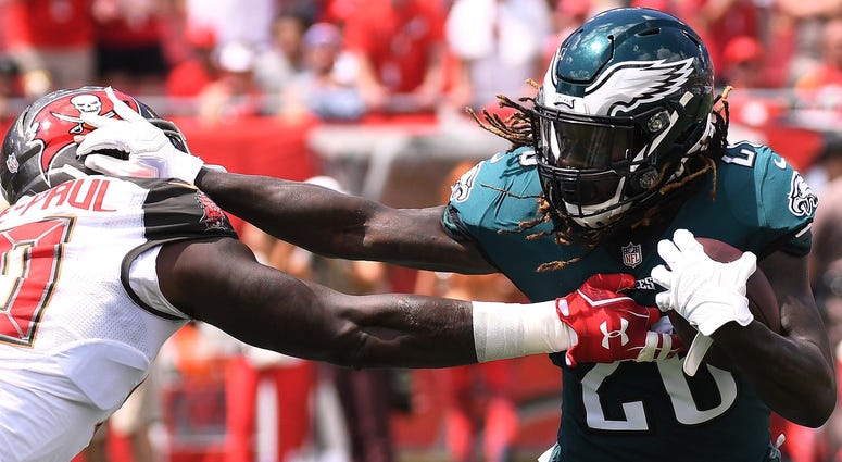 Philadelphia Eagles running back Jay Ajayi (26) tries to get past Tampa Bay Buccaneers defensive lineman Jason Pierre-Paul (90) in the first half at Raymond James Stadium on Sept. 16, 2018. Philadelphia Eagles running back Jay Ajayi (26) tries to get past Tampa Bay Buccaneers defensive lineman Jason Pierre-Paul (90) in the first half at Raymond James Stadium on Sept. 16, 2018.