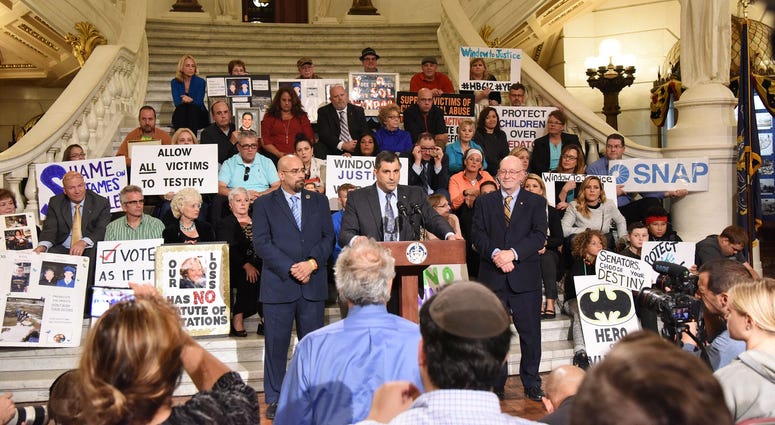 State Rep. Mark Rozzi (at podium) gives a speech supporting survivor victims of child abuse on Sept. 24, 2018 at the Capitol in Harrisburg. State Rep. Mark Rozzi