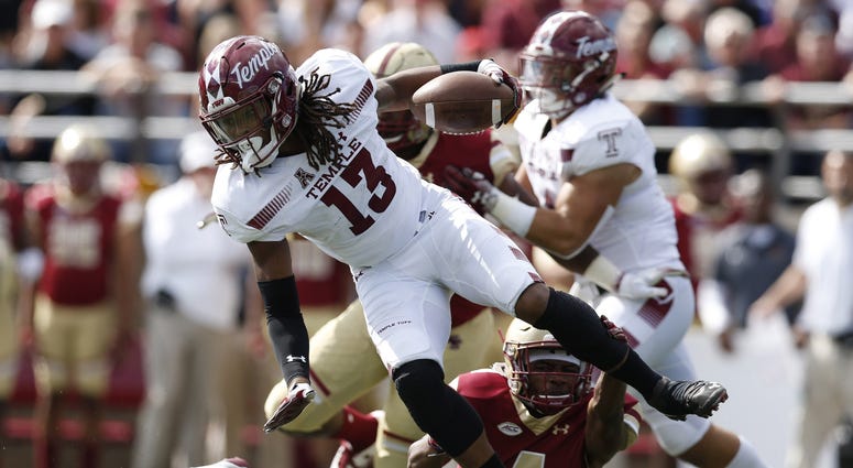 Sep 29, 2018; Chestnut Hill, MA, USA; Temple Owls wide receiver Isaiah Wright (13) is tackled by Boston College Eagles defensive back Hamp Cheevers (4) during the first half at Alumni Stadium. Sep 29, 2018; Chestnut Hill, MA, USA; Temple Owls wide receiver Isaiah Wright (13) is tackled by Boston College Eagles defensive back Hamp Cheevers (4) during the first half at Alumni Stadium.