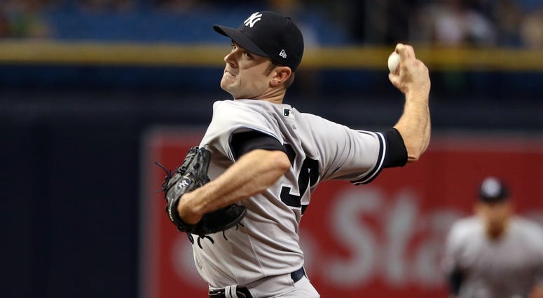 New York Yankees relief pitcher David Robertson (30) throws a pitch at Tropicana Field, Sept. 26, 2018, in St. Petersburg, Fla. New York Yankees relief pitcher David Robertson