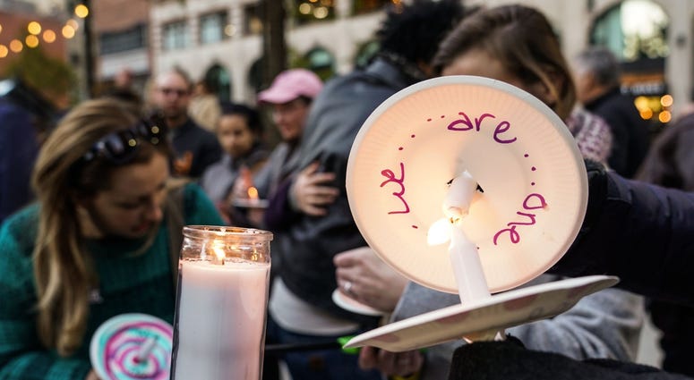Community members light candles while coming together during a vigil for the shooting victims killed inside the Tree of Life synagogue in Pittsburgh on Monday, October 29, 2018 at Capitol Park in downtown Detroit. Community members light candles while coming together during a vigil for the shooting victims killed inside the Tree of Life synagogue in Pittsburgh on Monday, October 29, 2018 at Capitol Park in downtown Detroit.