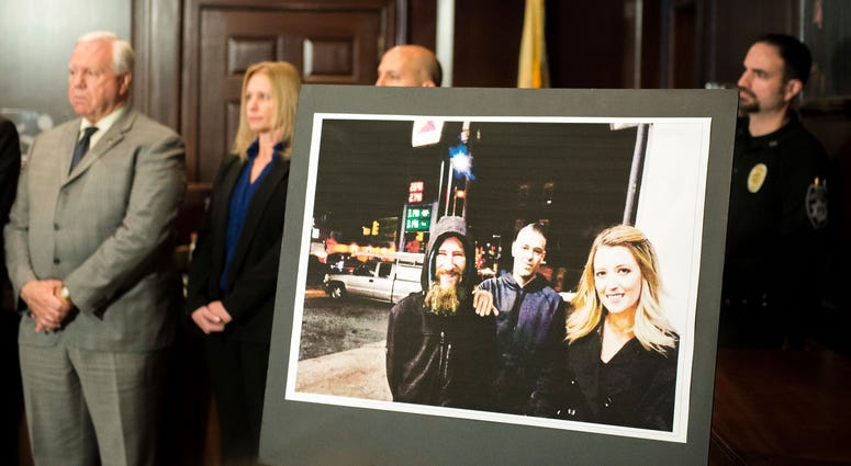 An image of Johnny Bobbitt Jr., from left, Mark D'Amico and Katelyn McClure on display during during a press conference Thursday, Nov. 15, 2018 in Mount Holly, N.J. An image of Johnny Bobbitt Jr., from left, Mark D'Amico and Katelyn McClure on display during during a press conference Thursday, Nov. 15, 2018 in Mount Holly, N.J.