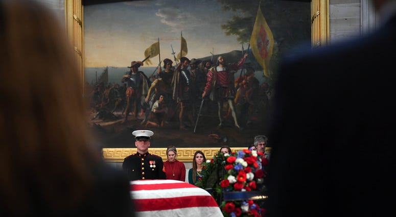 Dec 4, 2018; Washington, DC, U.S.A; Visitors to the Capitol Rotunda pay respects to President George H.W. Bush as he lies in state at the U.S. Capitol Rotunda. Dec 4, 2018; Washington, DC, U.S.A; Visitors to the Capitol Rotunda pay respects to President George H.W. Bush as he lies in state at the U.S. Capitol Rotunda.