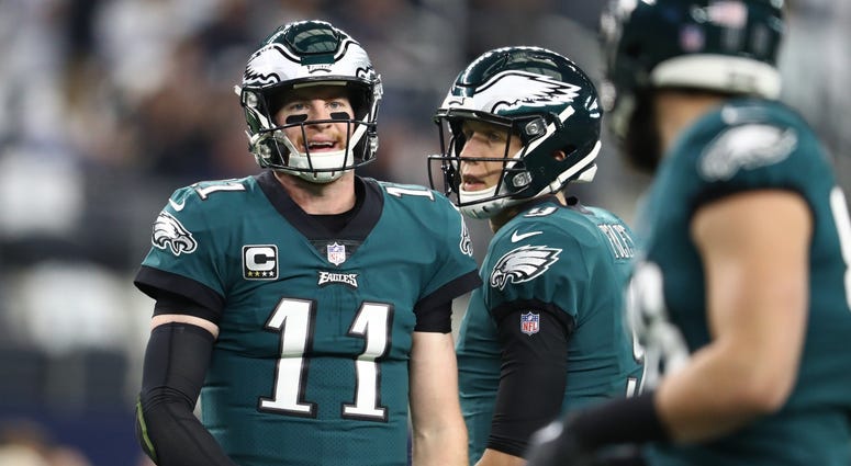 Philadelphia Eagles quarterback Carson Wentz (11) and Nick Foles (9) prior to the game against the Dallas Cowboys at AT&T Stadium, Dec. 9, 2018. Carson Wentz (11) and Nick Foles (9)