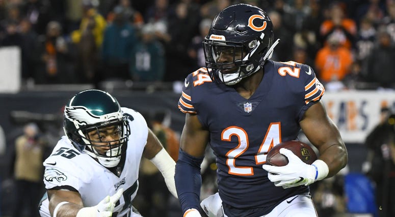 Chicago Bears running back Jordan Howard (24) runs the ball against Philadelphia Eagles defensive end Brandon Graham (55) in the first half of a NFC Wild Card playoff football game at Soldier Field, Jan. 6, 2019. Chicago Bears versus Philadelphia Eagles