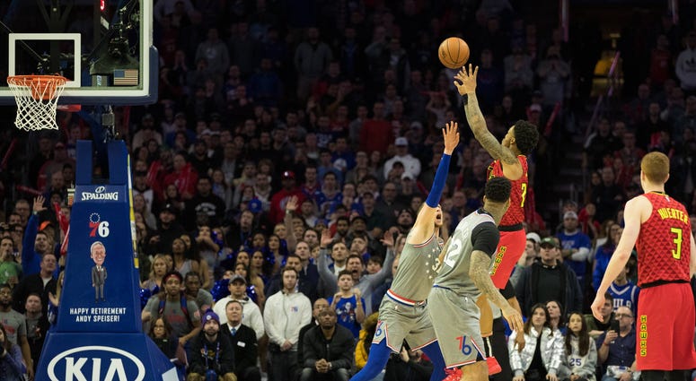 Atlanta Hawks forward John Collins (20) hits the game winning shot past Philadelphia 76ers center Mike Muscala (31) during the fourth quarter at Wells Fargo Center.