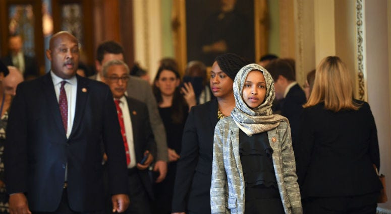Jan 24, 2019; Washington, DC, USA; Rep. Ilhan Omar (D-MN) and other House Democrat members walking from the Senate Chambers after the Senate voted to reject a pair of dueling bills Thursday to fund the federal government and end the longest partial govern Jan 24, 2019; Washington, DC, USA; Rep. Ilhan Omar (D-MN) and other House Democrat members walking from the Senate Chambers after the Senate voted to reject a pair of dueling bills Thursday to fund the federal government and end the longest partial govern