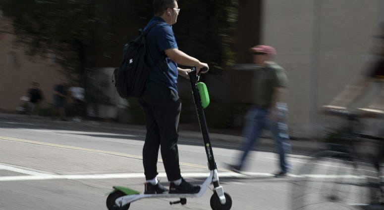 A man rides a scooter Oct. 4, 2018, in Tempe. A man rides a scooter Oct. 4, 2018, in Tempe.