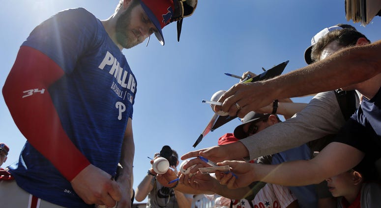 Philadelphia Phillies right fielder Bryce Harper (3) signs autographs for fans after he works out at Spectrum Field, March 3, 2019. Philadelphia Phillies right fielder Bryce Harper