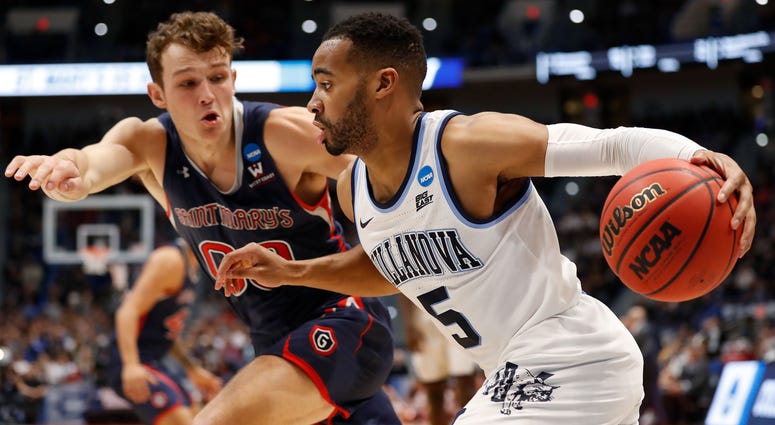 Villanova Wildcats guard Phil Booth (5) drives against St. Mary's Gaels guard Tanner Krebs (0) during the second half of a game in the first round of the 2019 NCAA Tournament at XL Center, March 21, 2019. Villanova versus Saint Mary's