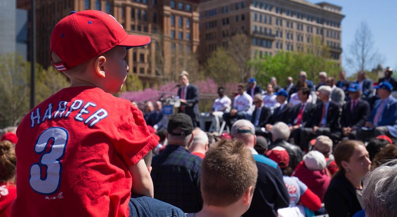 Apr 16, 2019; Philadelphia, PA, USA; A young fan looks on as Philadelphia Phillies owner John Middleton addresses fans and media during an event at Independence Mall to announce Philadelphia as the host of the 2026 All Star Game. Apr 16, 2019; Philadelphia, PA, USA; A young fan looks on as Philadelphia Phillies owner John Middleton addresses fans and media during an event at Independence Mall to announce Philadelphia as the host of the 2026 All Star Game.