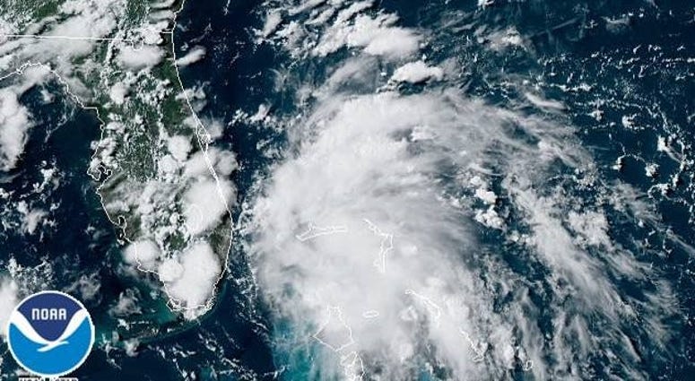 A satellite image shows a tropical depression spinning between the Bahamas and Florida. Depression A satellite image shows a tropical depression spinning between the Bahamas and Florida. Depression