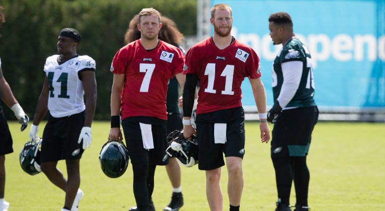 Jul 26, 2019; Philadelphia, PA, USA; Philadelphia Eagles quarterback Carson Wentz (11) and quarterback Nate Sudfeld (7) during training camp at Novacare Complex. Jul 26, 2019; Philadelphia, PA, USA; Philadelphia Eagles quarterback Carson Wentz (11) and quarterback Nate Sudfeld (7) during training camp at Novacare Complex.