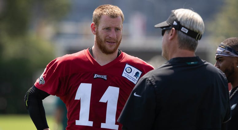 Eagles quarterback Carson Wentz and head coach Doug Pederson during training camp at Novacare Complex, on July 26, 2019. Eagles quarterback Carson Wentz and head coach Doug Pederson during training camp at Novacare Complex, on July 26, 2019.