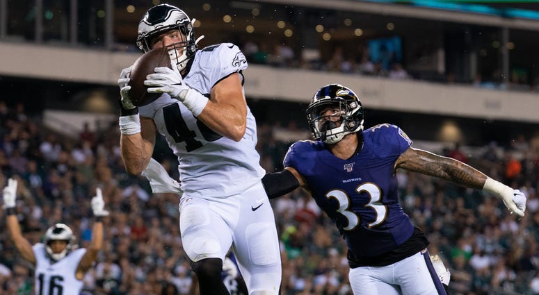 Philadelphia Eagles tight end Alex Ellis (48) catches a touchdown pass against Baltimore Ravens defensive back Bennett Jackson (33) during the third quarter at Lincoln Financial Field, Aug. 22, 2019. Philadelphia Eagles tight end Alex Ellis