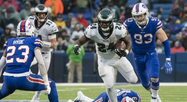 Oct 27, 2019; Orchard Park, NY, USA; Philadelphia Eagles running back Jordan Howard (24) tries to avoid a tackle by Buffalo Bills strong safety Micah Hyde (23) and defensive end Trent Murphy (93) in the fourth quarter at New Era Field. Philadelphia Eagles running back Jordan Howard (24) tries to avoid a tackle by Buffalo Bills strong safety Micah Hyde (23) and defensive end Trent Murphy (93).