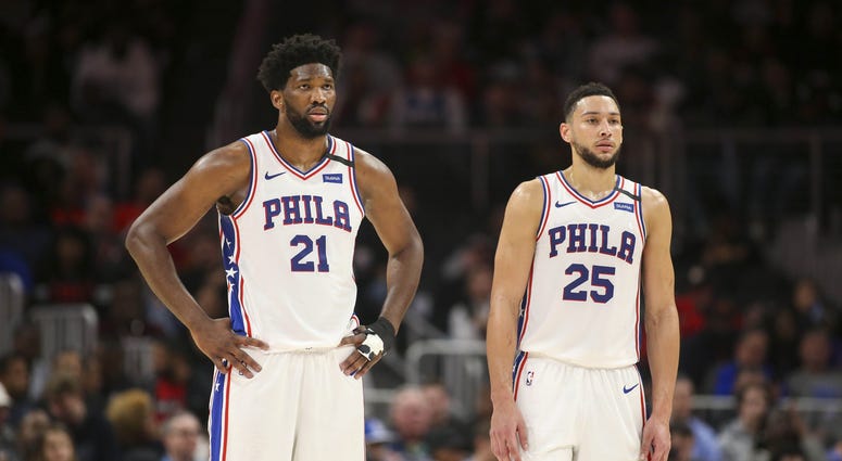 Philadelphia 76ers center Joel Embiid (21) and guard Ben Simmons (25) during a free throw against the Atlanta Hawks in the second quarter at State Farm Arena. Philadelphia 76ers center Joel Embiid (21) and guard Ben Simmons (25) during a free throw against the Atlanta Hawks in the second quarter at State Farm Arena.