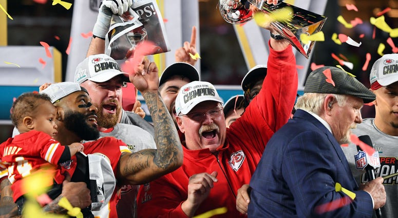Kansas City Chiefs head coach Andy Reid hoists the Vince Lombardi Trophy after defeating the San Francisco 49ers in Super Bowl LIV at Hard Rock Stadium. Kansas City Chiefs head coach Andy Reid