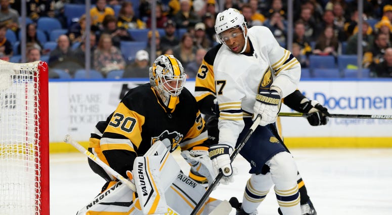Pittsburgh Penguins goaltender Matt Murray (30) and Buffalo Sabres right wing Wayne Simmonds (17) look for the puck during the second period at KeyBank Center. Pittsburgh Penguins goaltender Matt Murray (30) and Buffalo Sabres right wing Wayne Simmonds (17) look for the puck during the second period at KeyBank Center.