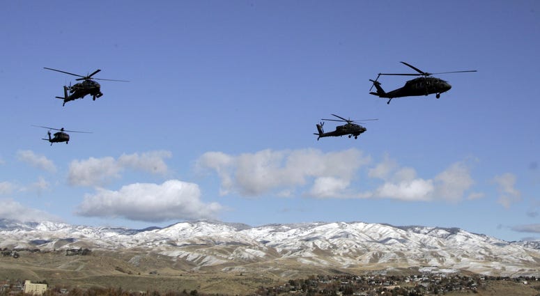 A flight of Apache and Blackhawk helicopter from the Idaho National Guard perform a fly over prior to the first half against the Idaho Vandals at Bronco Stadium. A flight of Apache and Blackhawk helicopter from the Idaho National Guard perform a fly over prior to the first half against the Idaho Vandals at Bronco Stadium.