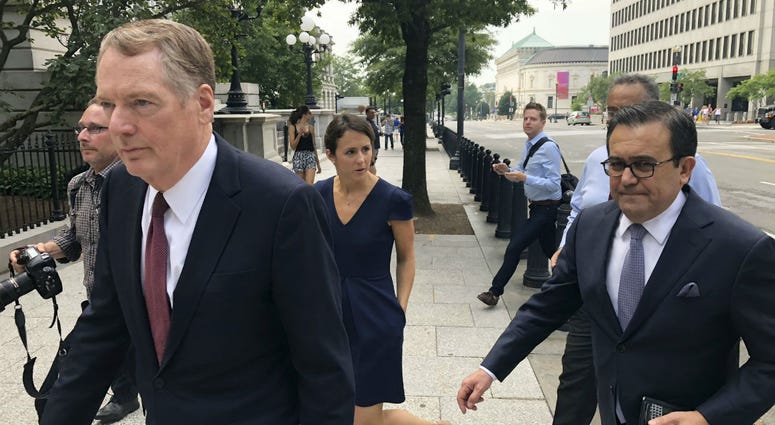 United States Trade Representative Robert Lighthizer, left, and Mexican Secretary of Economy Idelfonso Guajardo, right, walk to the White House on Monday August 27, 2018. United States Trade Representative Robert Lighthizer, left, and Mexican Secretary of Economy Idelfonso Guajardo, right, walk to the White House on Monday August 27, 2018.