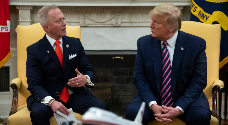 In this Dec. 19, 2019 photo, President Donald Trump meets with Rep. Jeff Van Drew, D-N.J., who is planning to switch his party affiliation, in the Oval Office of the White House in Washington. Trump meets with Rep. Jeff Van Drew