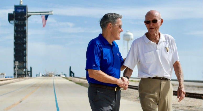 In this Tuesday, July 16, 2019 photo made available by NASA, astronaut Michael Collins, right, speaks to Kennedy Space Center Director Bob Cabana at Launch Complex 39A, about the moments leading up to launch at 9:32 a.m. on July 16, 1969, and what it was In this Tuesday, July 16, 2019 photo made available by NASA, astronaut Michael Collins, right, speaks to Kennedy Space Center Director Bob Cabana at Launch Complex 39A, about the moments leading up to launch at 9:32 a.m. on July 16, 1969, and what it was
