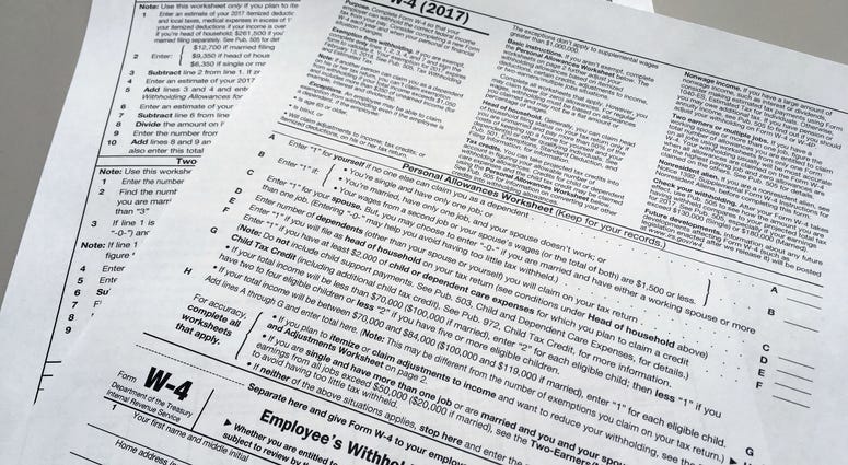 This Feb. 1, 2018 file photo shows an IRS W-4 form in New York. On Friday, May 31, 2019, the IRS is expected to release a proposed update to the form. Experts say that while it will be much more accurate, it will also be much more difficult. This Feb. 1, 2018 file photo shows an IRS W-4 form in New York. On Friday, May 31, 2019, the IRS is expected to release a proposed update to the form. Experts say that while it will be much more accurate, it will also be much more difficult.