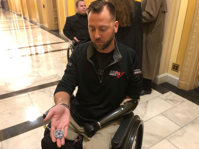 Veteran Adam Keys, who grew up in the Lehigh Valley, shows the Presidential Challenge Coin given to him by George H.W. Bush. Veteran Adam Keys, who grew up in the Lehigh Valley, shows the Presidential Challenge Coin given to him by George H.W. Bush.