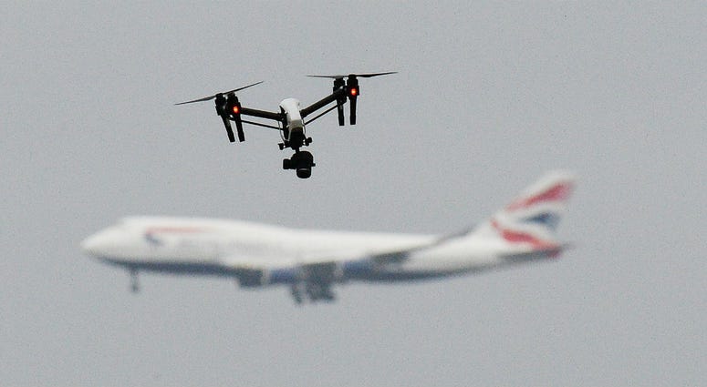 File photo dated 25/2/2017 of a drone and an aircraft. Gatwick airport remains closed this morning after drones were spotted over the airfield last night and this morning. File photo dated 25/2/2017 of a drone and an aircraft.