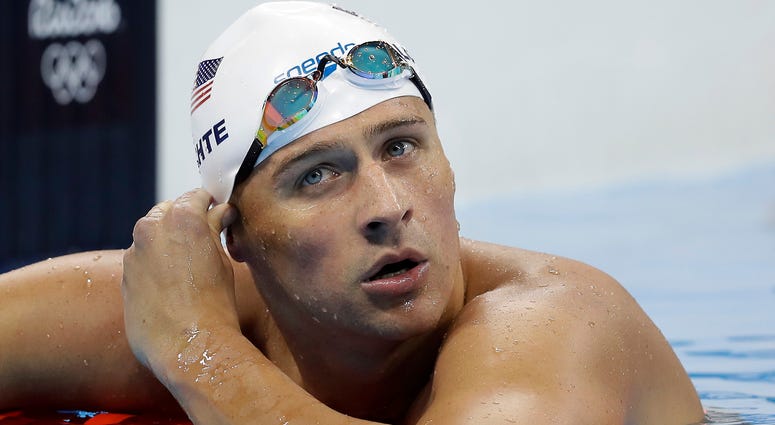 In this Aug. 9, 2016, file photo, United States' Ryan Lochte checks his time in a men's 4x200-meter freestyle heat at the 2016 Summer Olympics, in Rio de Janeiro, Brazil. In this Aug. 9, 2016, file photo, United States' Ryan Lochte checks his time in a men's 4x200-meter freestyle heat at the 2016 Summer Olympics, in Rio de Janeiro, Brazil.
