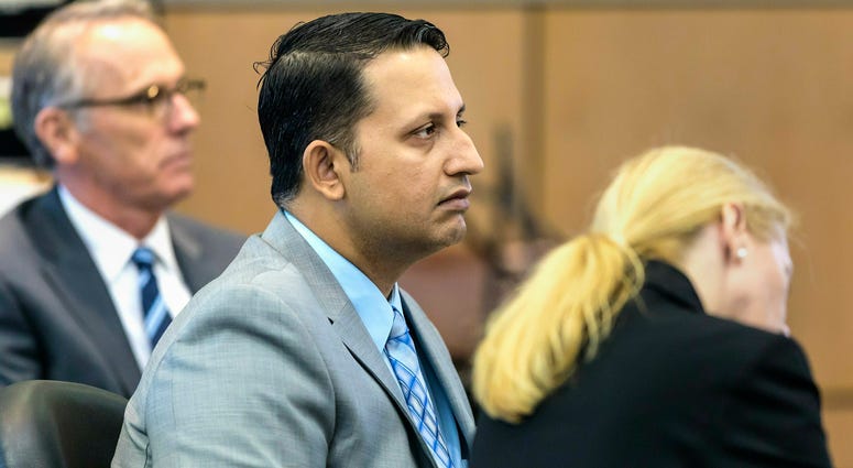 Nouman Raja sits between defense attorney Scott Richardson, left, and paralegal Debi Stratton as attorney Richard Lubin gives his closing arguments in Raja's trial, Wednesday, March 6, 2019 in West Palm Beach, Fla. Nouman Raja sits between defense attorney Scott Richardson, left, and paralegal Debi Stratton as attorney Richard Lubin gives his closing arguments in Raja's trial, Wednesday, March 6, 2019 in West Palm Beach, Fla.