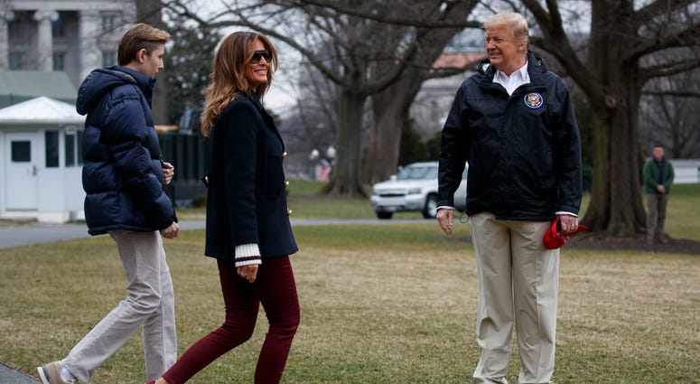 In this March 8, 2019 file photo, President Donald Trump waits for his son Barron Trump, and first lady Melania Trump after speaking with reporters before traveling to Alabama to visit areas affected by the deadly tornadoes. In this March 8, 2019 file photo, President Donald Trump waits for his son Barron Trump, and first lady Melania Trump after speaking with reporters before traveling to Alabama to visit areas affected by the deadly tornadoes.