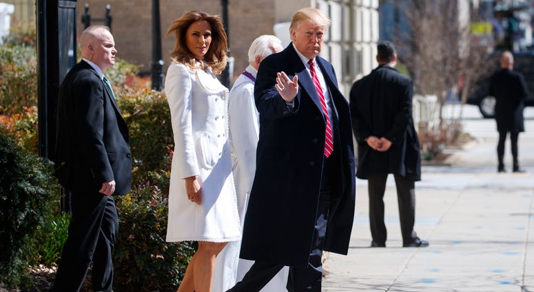President Donald Trump and first lady Melania Trump, with Reverend Bruce McPherson, walk to their motorcade after attending service at Saint John's Church in Washington, Sunday, March 17, 2019, en route to the White House. ( President Donald Trump and first lady Melania Trump, with Reverend Bruce McPherson, walk to their motorcade after attending service at Saint John's Church in Washington, Sunday, March 17, 2019, en route to the White House. (