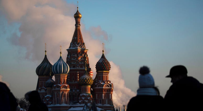 In this Thursday, Jan. 24, 2019 file photo, people walk in Red Square on a cold day, with St. Basil's Cathedral in the background, in Moscow, Russia. In this Thursday, Jan. 24, 2019 file photo, people walk in Red Square on a cold day, with St. Basil's Cathedral in the background, in Moscow, Russia.