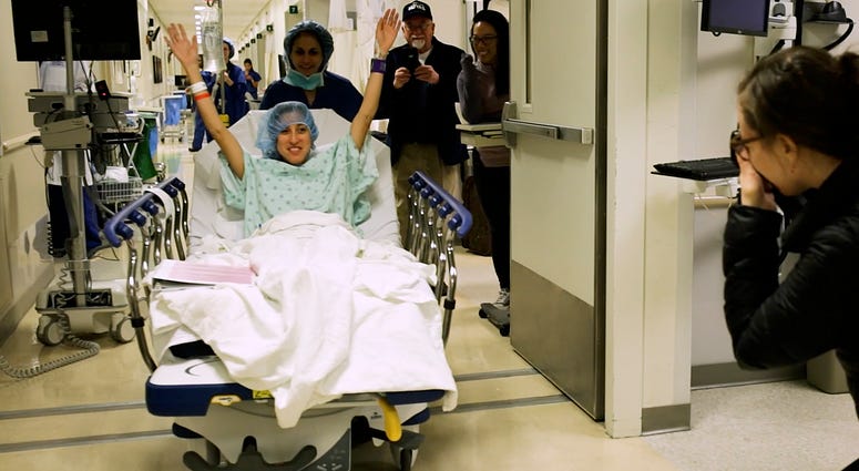 In this image made from video provided by Johns Hopkins Medicine, Nina Martinez of Atlanta is wheeled into a Baltimore operating room to become who is thought to be the world’s first kidney transplant living donor with HIV, on Monday, March 25, 2019. In this image made from video provided by Johns Hopkins Medicine, Nina Martinez of Atlanta is wheeled into a Baltimore operating room to become who is thought to be the world’s first kidney transplant living donor with HIV, on Monday, March 25, 2019.