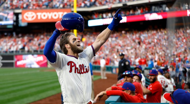 Philadelphia Phillies' Bryce Harper celebrates after hitting a home run off Atlanta Braves relief pitcher Jesse Biddle during the seventh inning of a baseball game, Saturday, March 30, 2019, in Philadelphia. Philadelphia Phillies' Bryce Harper celebrates after hitting a home run off Atlanta Braves relief pitcher Jesse Biddle during the seventh inning of a baseball game, Saturday, March 30, 2019, in Philadelphia.