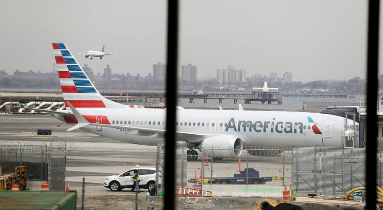 FILE - In a March 13, 2019 file photo, an American Airlines Boeing 737 MAX 8 sits at a boarding gate at LaGuardia Airport in New York. American Airlines said Sunday, April 7, 2019 it is extending by over a month its cancellations of about 90 daily flights FILE - In a March 13, 2019 file photo, an American Airlines Boeing 737 MAX 8 sits at a boarding gate at LaGuardia Airport in New York. American Airlines said Sunday, April 7, 2019 it is extending by over a month its cancellations of about 90 daily flights